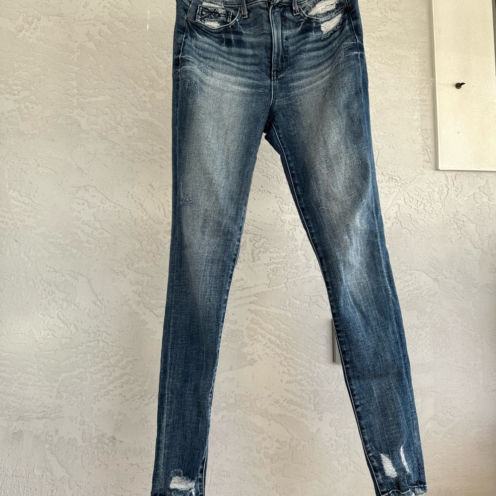 Buckle Blue Skinny Jeans with Distressed Hem and Faded Wash